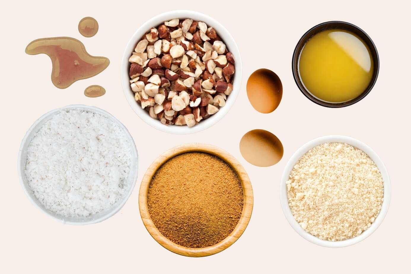 Landscape Images - toffee bar ingredients Gluten-free coconut hazelnut bar ingredients including almond flour, coconut sugar, maple syrup, eggs, ghee, nuts, and coconut