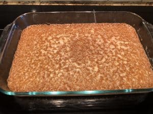 Caramelized and bubbly baked almond flour crust for gluten-free coconut hazelnut bars showing normal texture after baking