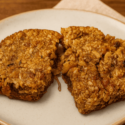 Gluten-free coconut hazelnut bars made with a toffee-like almond flour crust and chewy topping of coconut and chopped nuts