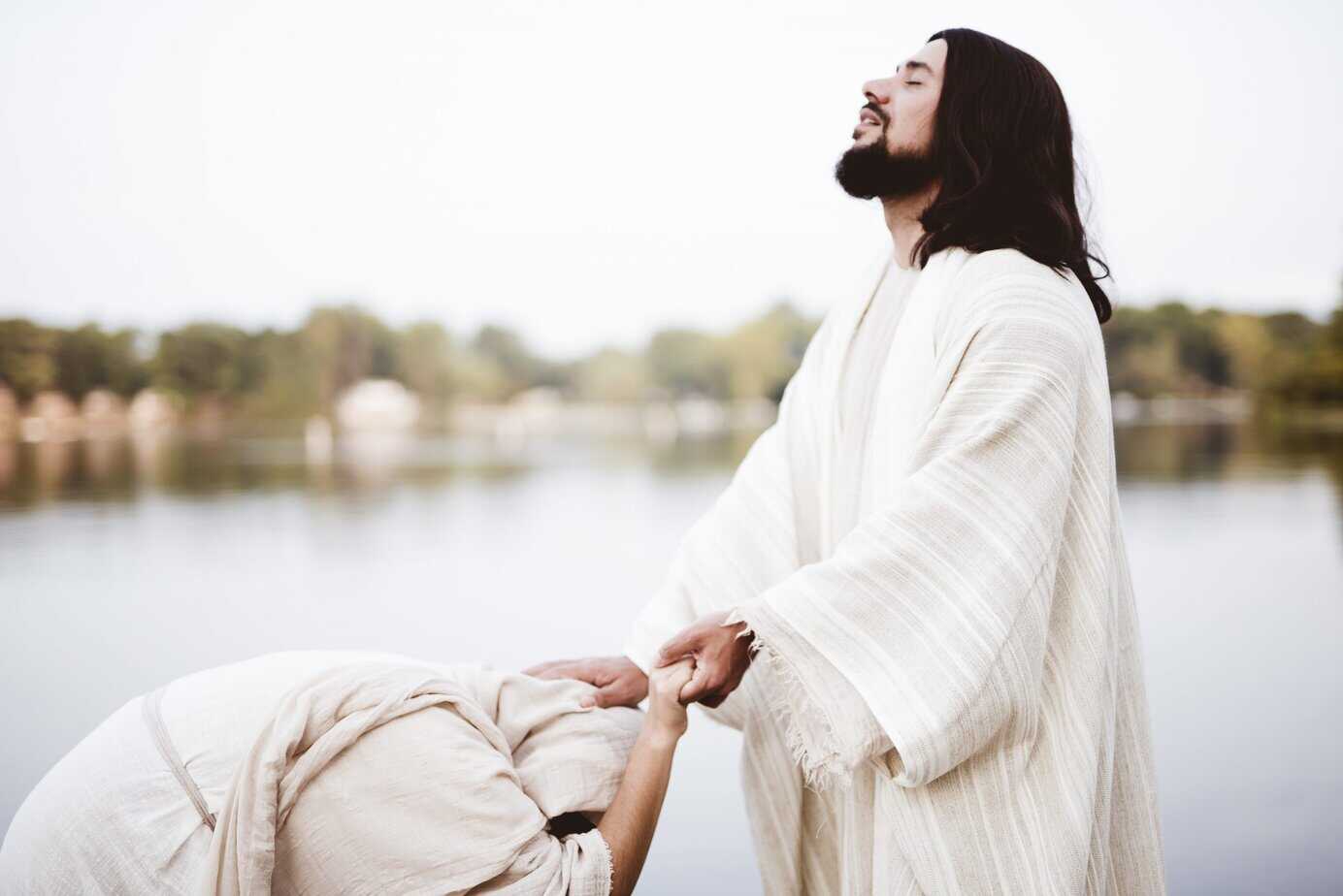 Jesus Christ offering healing and rest to a woman by the water, illustrating the spiritual and physical restoration available through divine rest