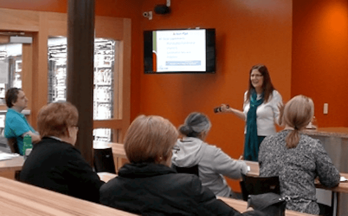 Terri Ward presenting a health and nutrition talk to an audience at Natural Grocers