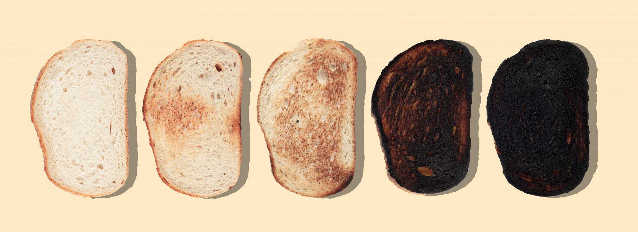 slices of bread at different stages of toasting with last one co Slices of bread showing progressive stages of toasting from light golden to dark brown, illustrating the Maillard reaction