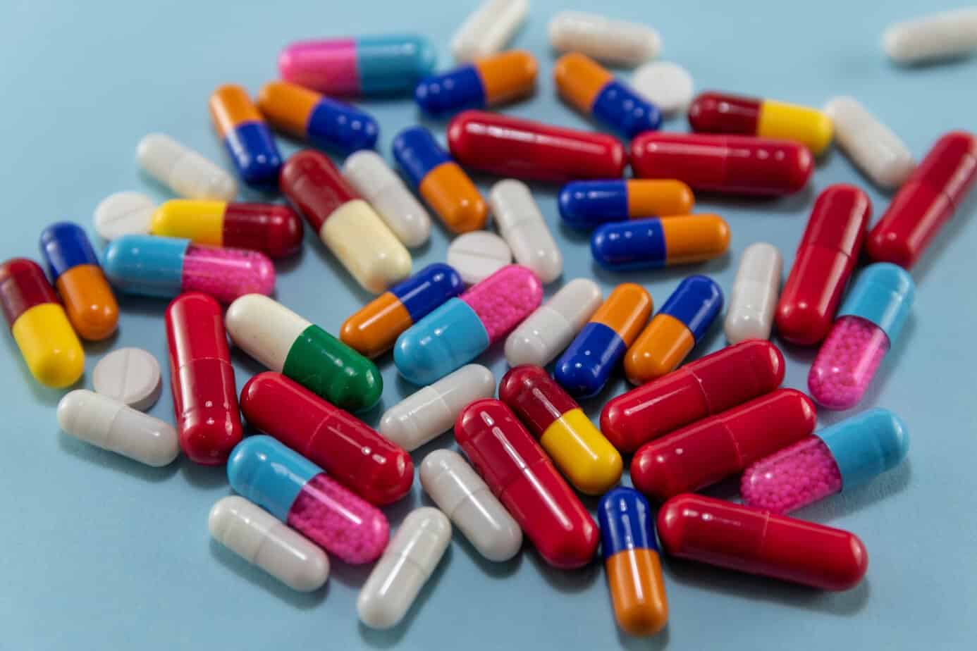 Colorful medication capsules and pills containing artificial dyes