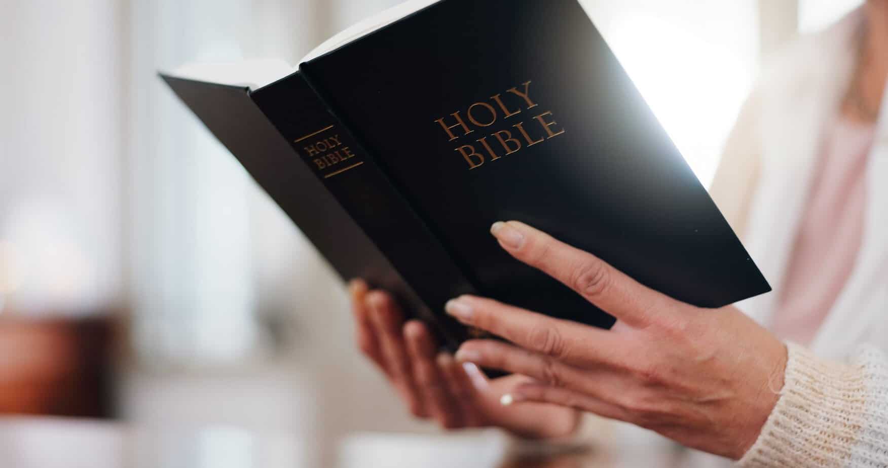 Woman holding Holy Bible, representing the practice of daily Scripture meditation for mindset renewal and spiritual anchoring