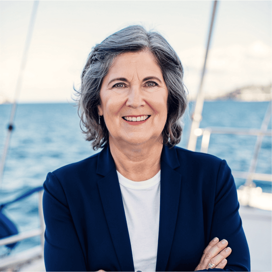 Functional nutritionist, author, and speaker Terri Ward on a boat wearing a blue blazer with her arms crossed