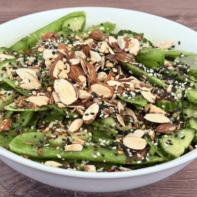 Sesame Snow Pea Salad with cucumber, toasted almonds, black and white sesame seeds, cilantro, and a ginger-sesame dressing